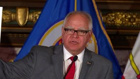 Gov. Walz says 'here's the schedule' for gun reform hearing while holding up blank paper