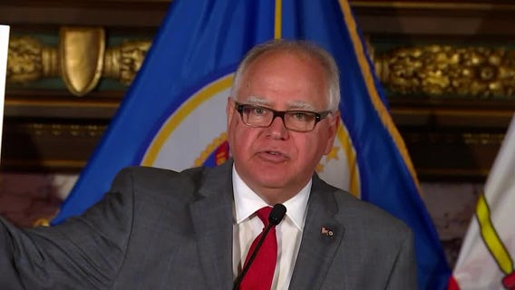 Gov. Walz says 'here's the schedule' for gun reform hearing while holding up blank paper