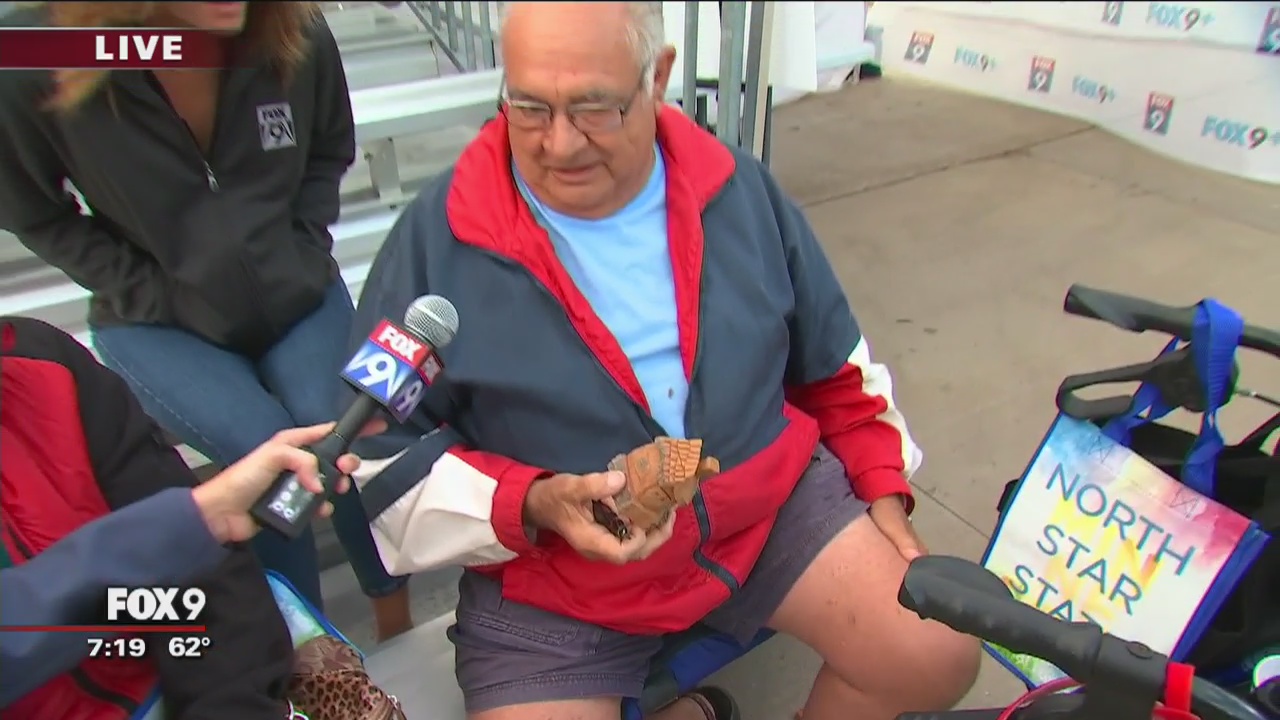 Reynold carves wooden house at Minnesota State Fair