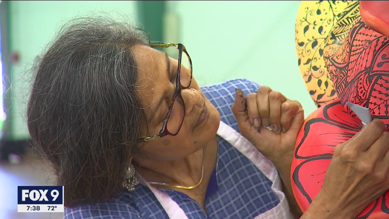 Artists design gigantic roses for display in Roseville