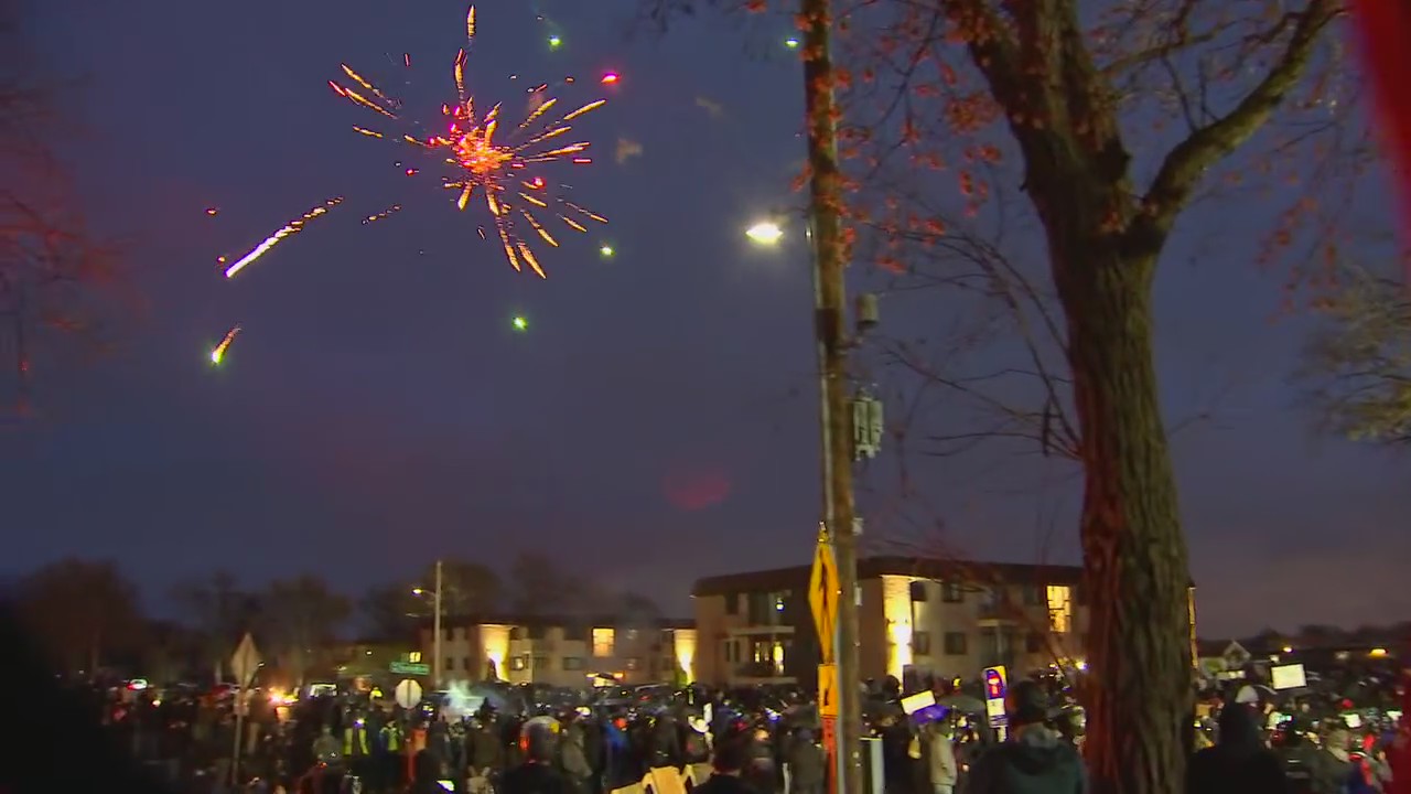 Protesters light off fireworks outside Brooklyn Center Police Department