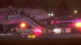 Stuck plane at MSP Airport during snowy night