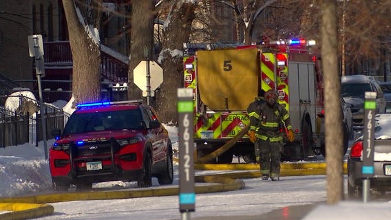 Raw video: Minneapolis firefighters battle house fire in icy conditions