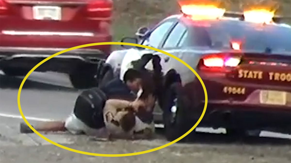 State Trooper wrestles highway pedestrian to the ground