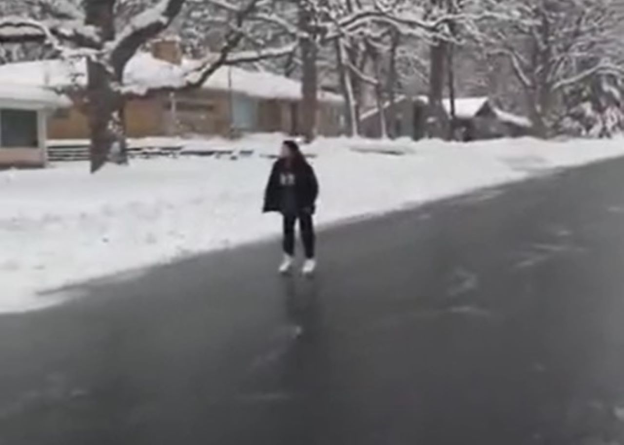 Girl skates down street in Roseville, Minnesota