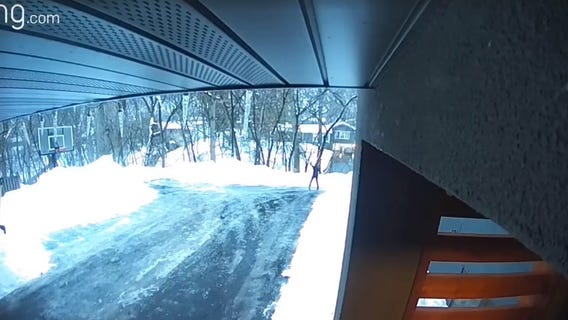 It's slick out there! Father slides down icy road in Bloomington