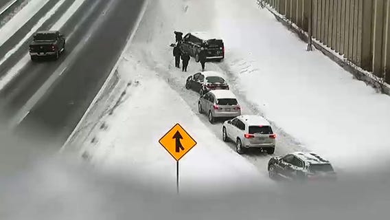 Minnesota drivers hand-shovel Highway 100 to clear traffic jam