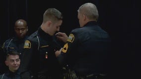 Father welcomes son onto police force