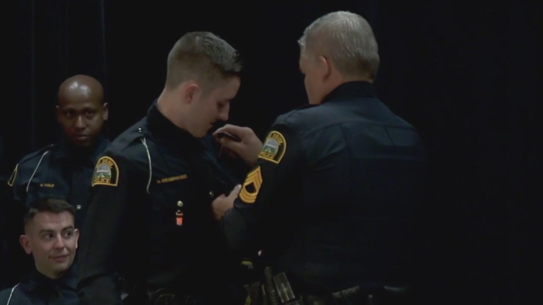Father welcomes son onto police force