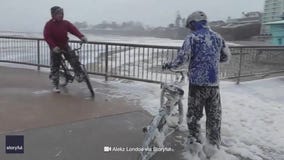Flying seafoam covered bicyclists in California