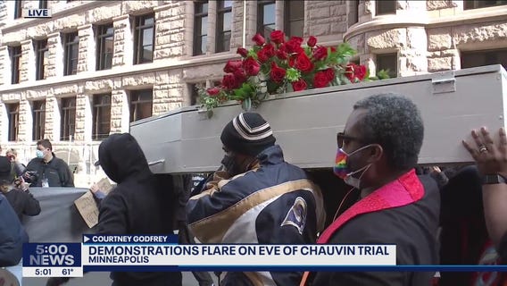 Activists lead march through downtown Minneapolis on eve of Chauvin trial