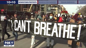 Activists lead march through downtown Minneapolis on eve of Chauvin trial