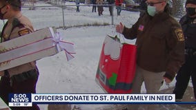 Officers donate holiday gifts to Minnesota families in need