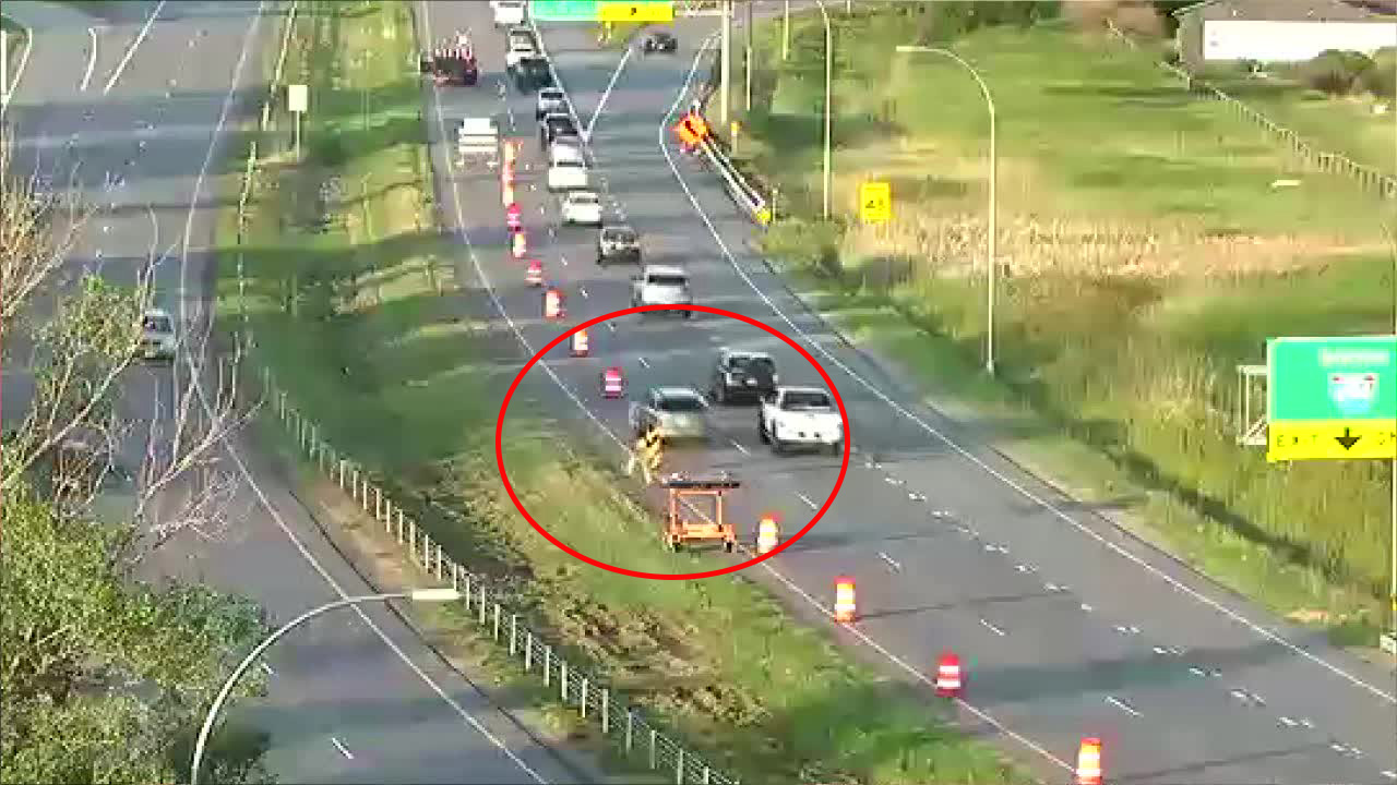 Construction worker hit by traffic barrel