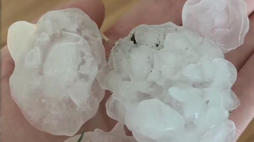 Homeowners clean up after severe hailstorm