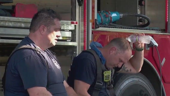 Fire crews battles flames in blazing heat