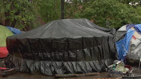 Mpls homeless encampment building yurts