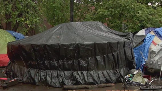 Mpls homeless encampment building yurts