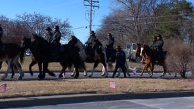 Officers on horses arrive for Burnsville service