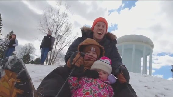 MN families enjoy spring snowfall