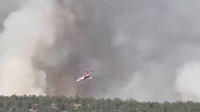 Wildfires continue to burn in western US