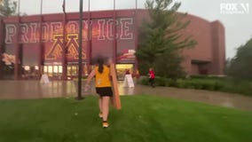 U of M tailgaters run for cover during storm