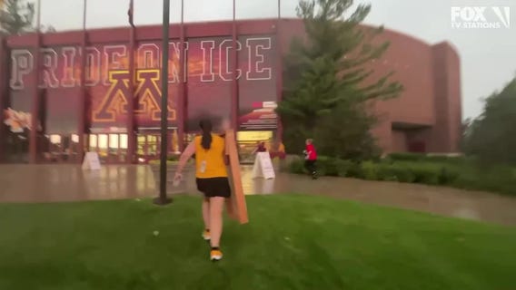U of M tailgaters run for cover during storm