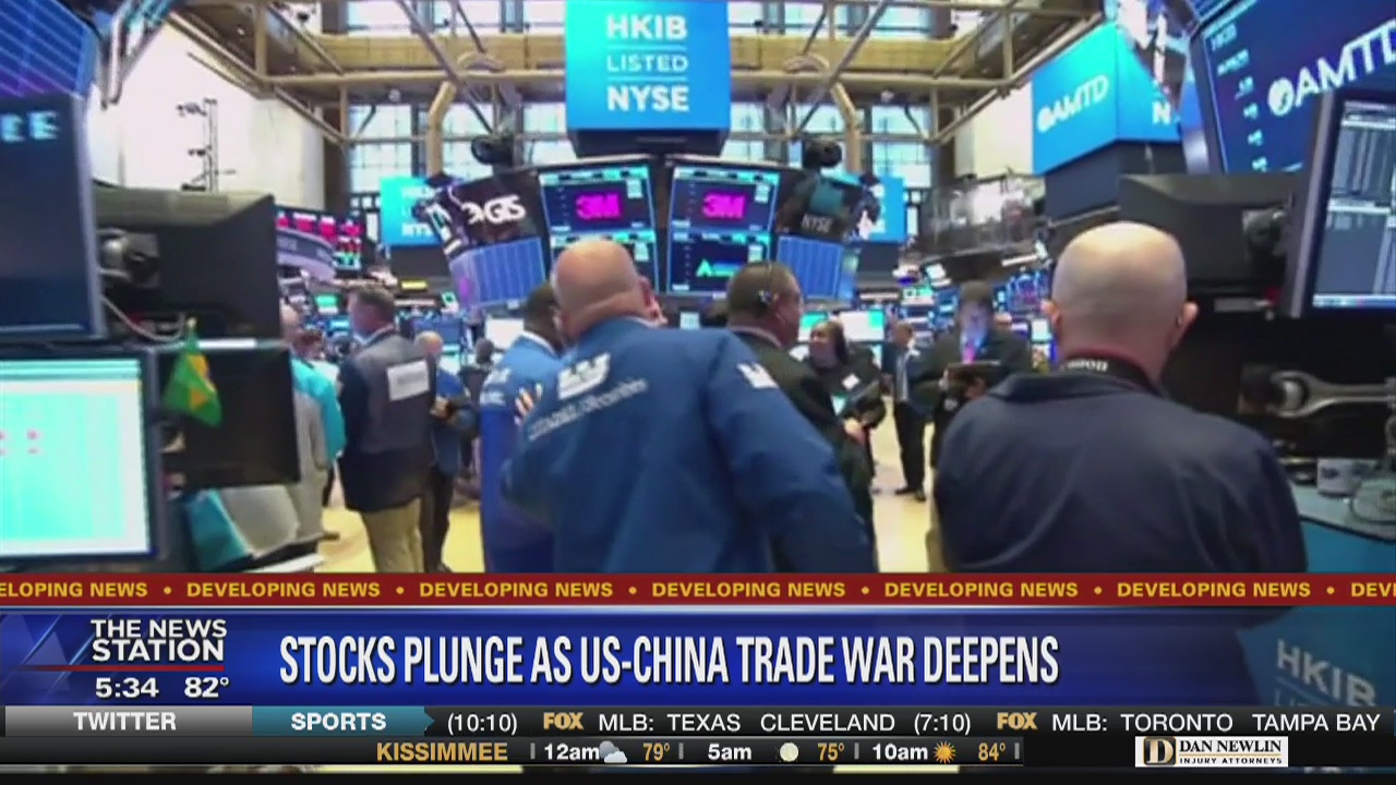 Stocks tumble amid trade war fears