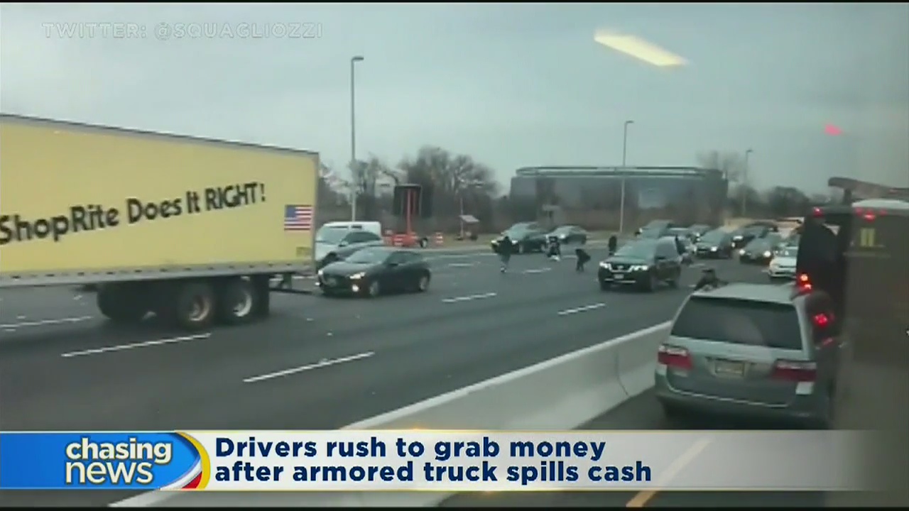 Drivers rush to grab money after truck spills cash