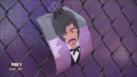 Fans pay tribute to Prince at new purple fence at Paisley Park