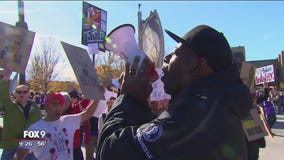 Protesters take a knee outside U.S. Bank Stadium Sunday