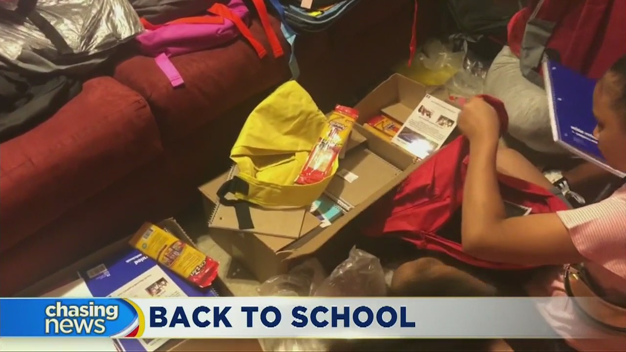 Young volunteers fill backpacks in Bronx