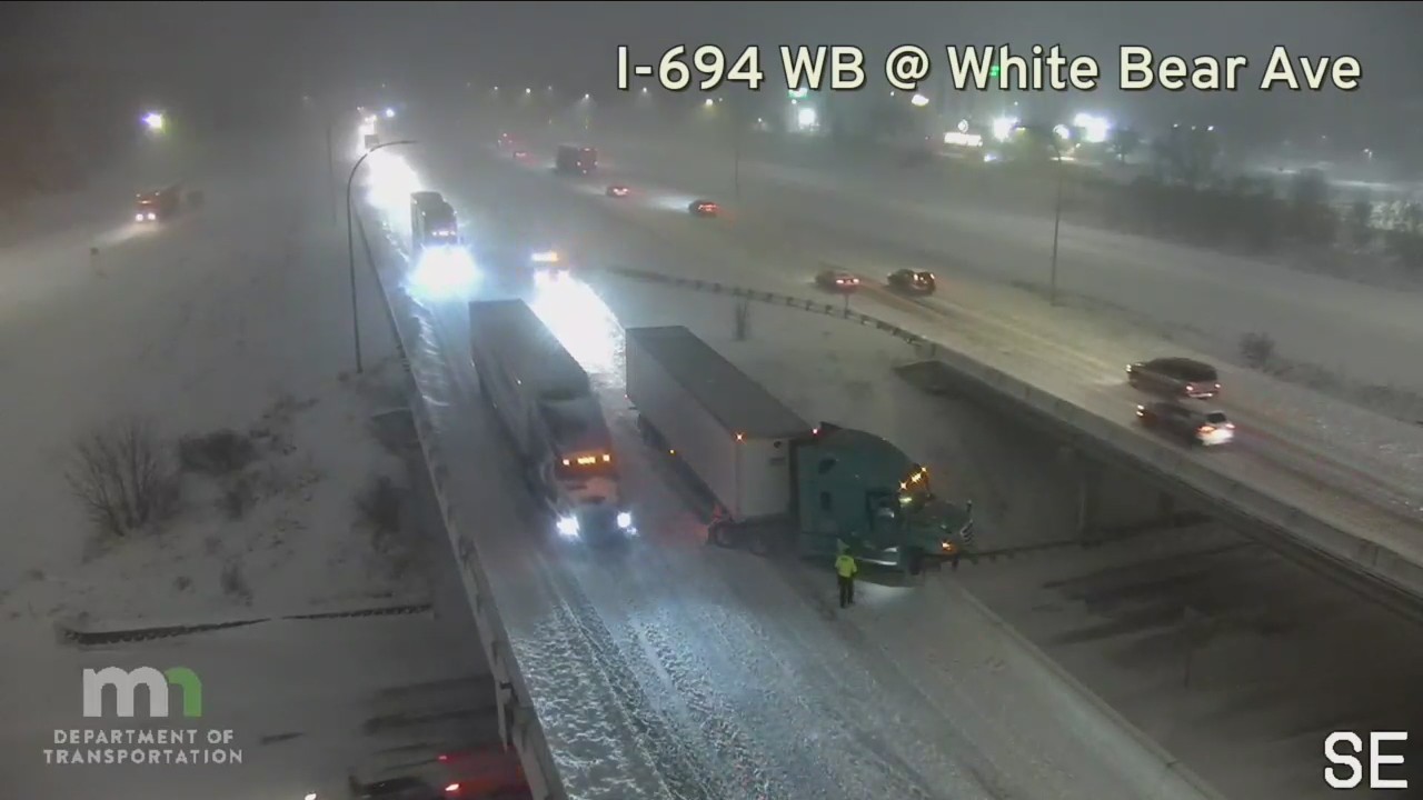 Semi-truck teeters on edge of MN bridge [RAW]