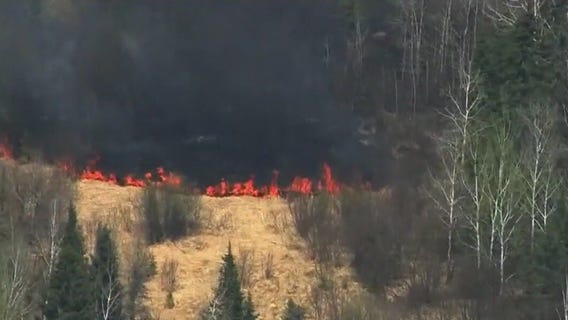 Crews fight to contain wildfires in northern MN