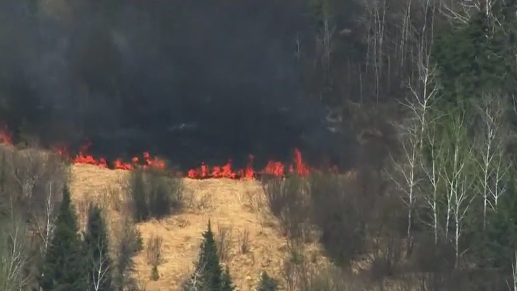 Crews fight to contain wildfires in northern MN