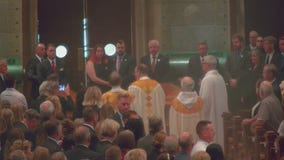 Hortmans funeral: Caskets carried to altar