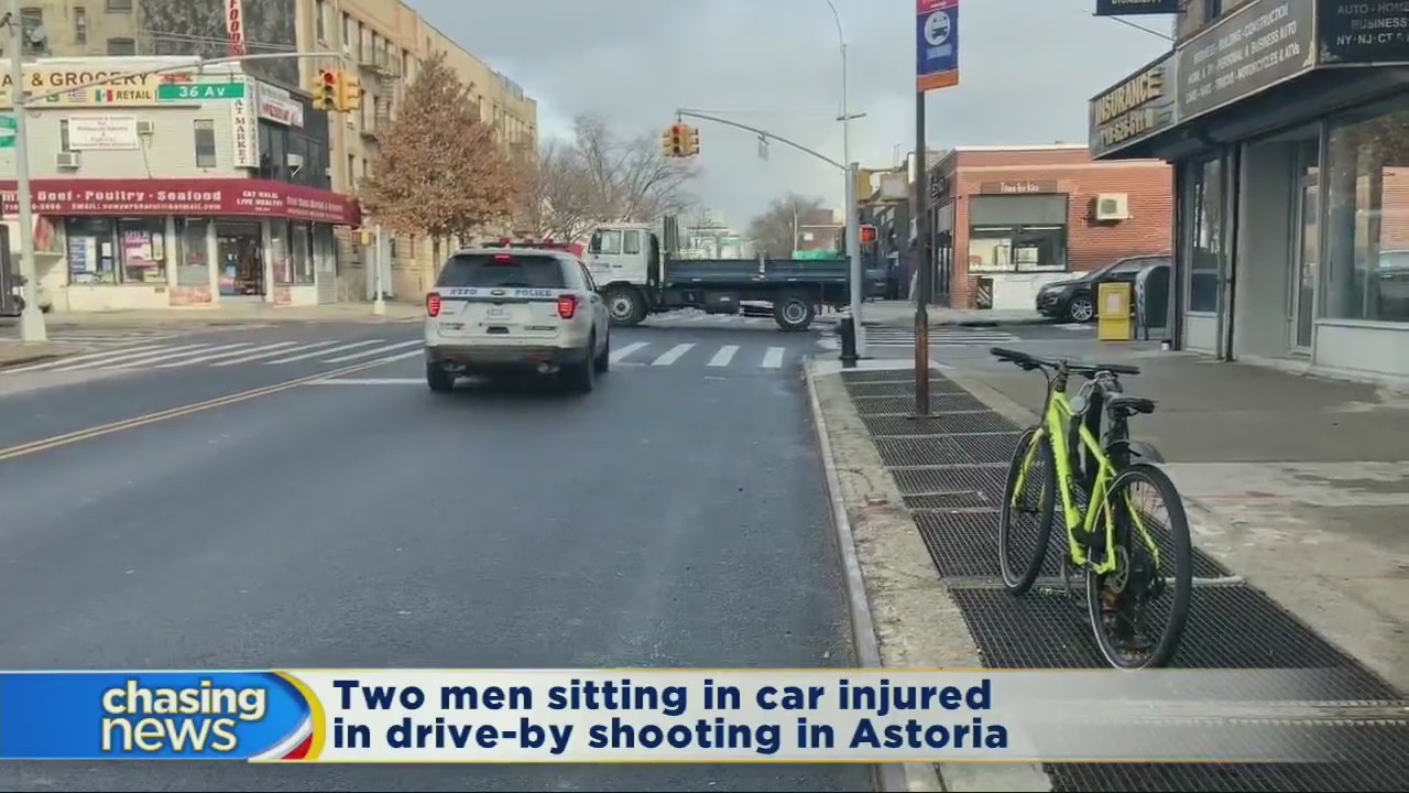 Two men sitting in car injured in drive-by shooting in Astoria
