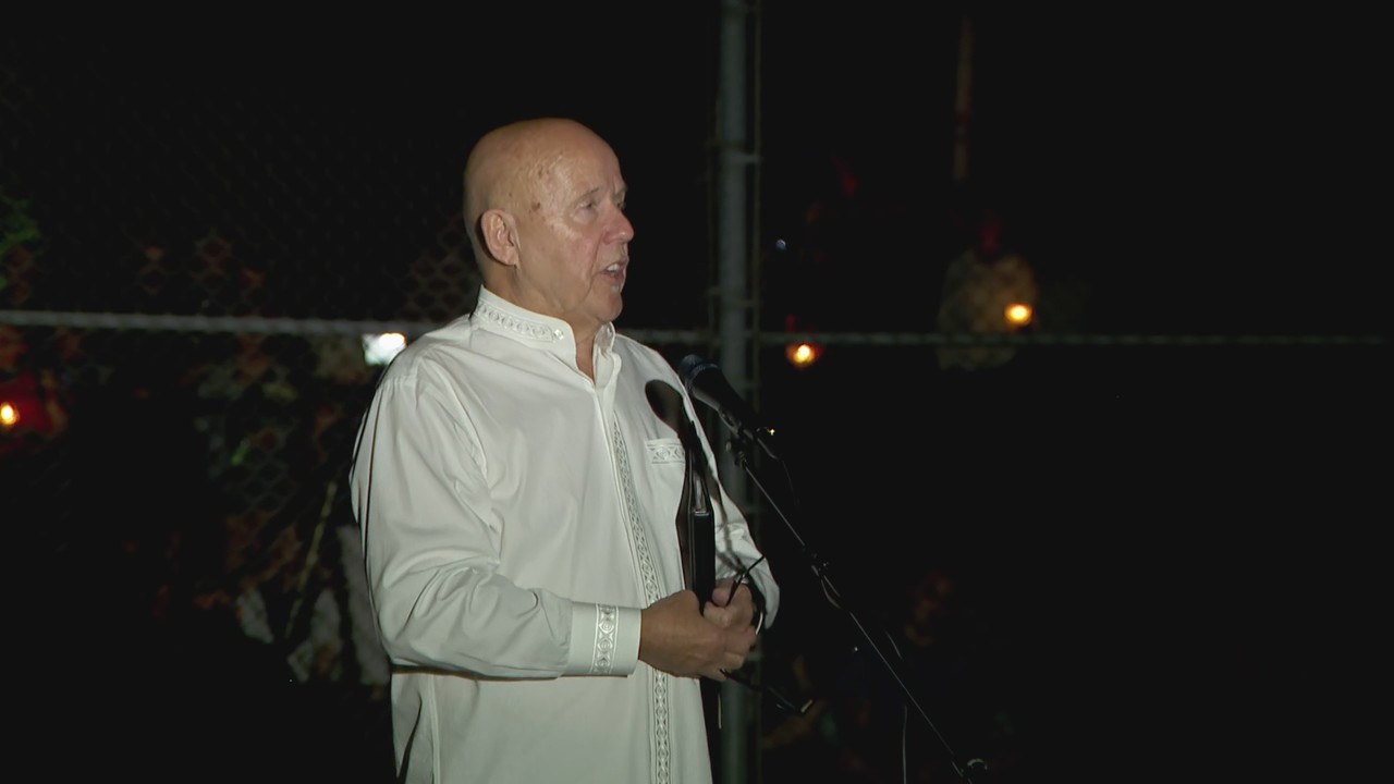 Father Jim Cassidy offers prayer at Annunciation shooting vigil