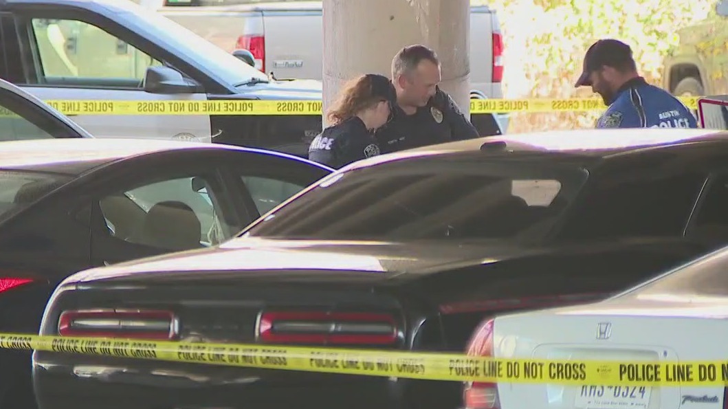 Body found in public parking lot under I-35