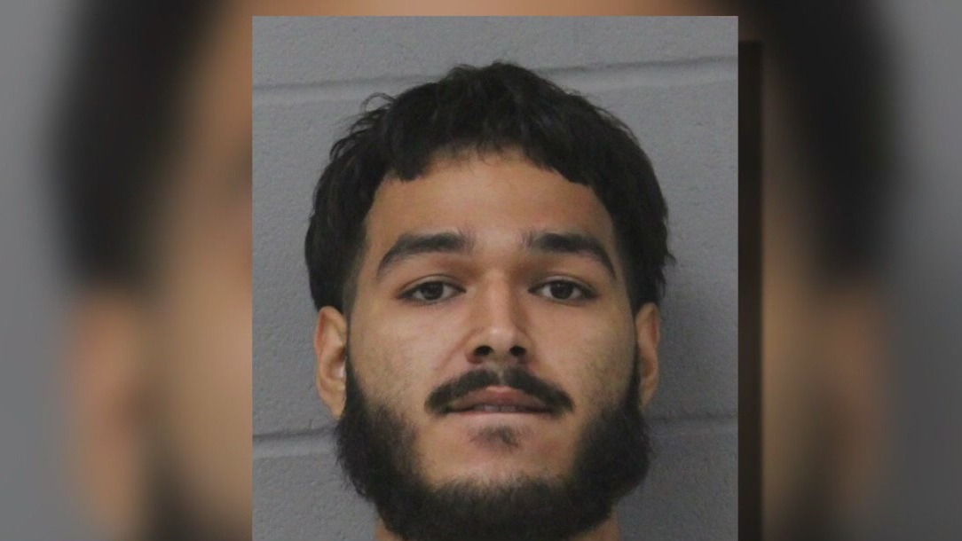Man arrested for waving gun at driver
