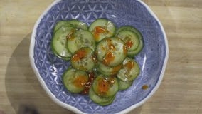 Cucumber salad and frito pie from Texas Sushiko