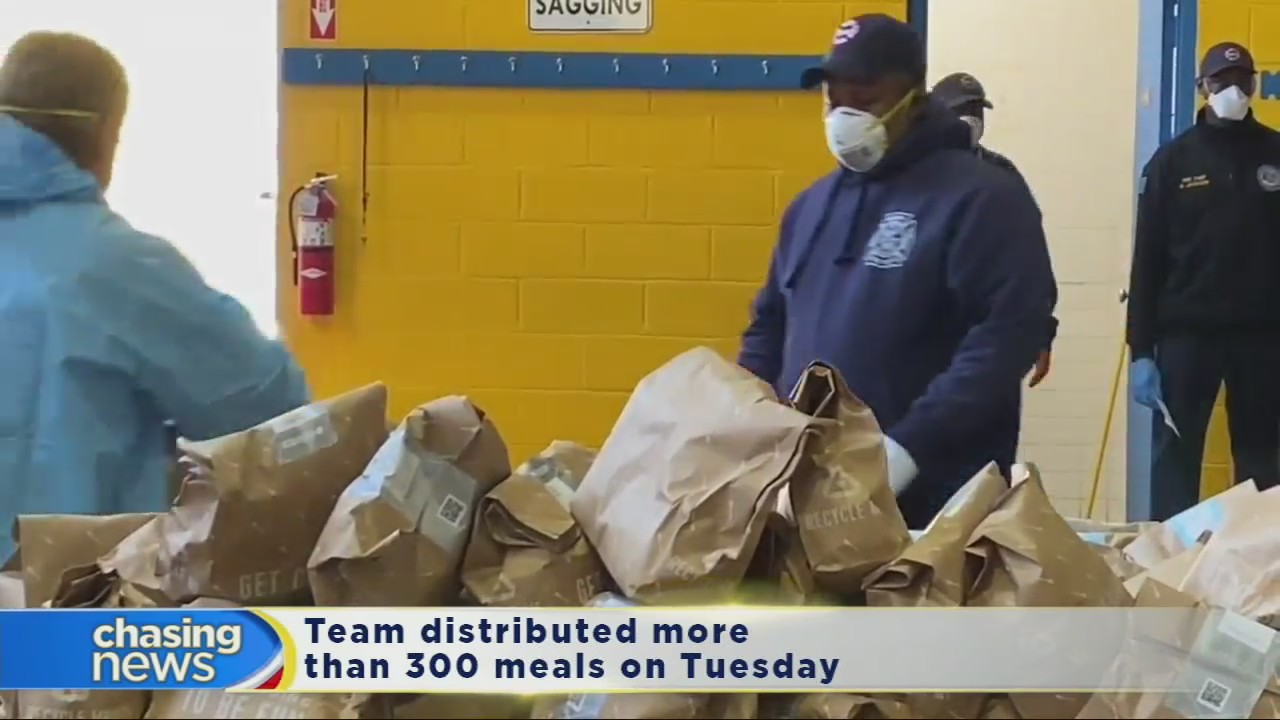 Newark firefighters pack and distribute food to the needy