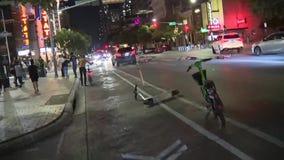 VIDEO: Protesters move scooters, barriers into street