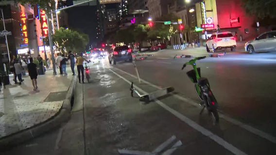 VIDEO: Protesters move scooters, barriers into street