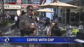 CHP drinking coffee with the community