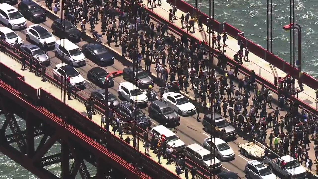 Protesters march into traffic on the Golden Gate Bridge