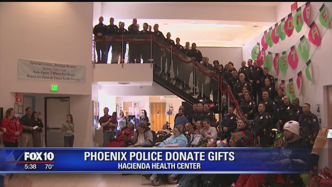 Phoenix police give Christmas gifts to residents at Valley facility