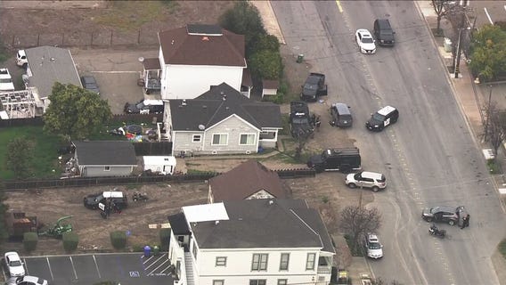 Fremont police have guns drawn on residence