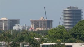 Officials suspend recovery operations at condo collapse as explosives are installed in remaining building