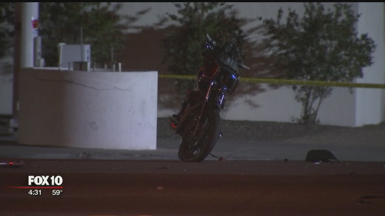 Motorcyclist hits patrol car while police officer is inside